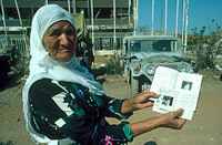 A Palestinian mother shows her missing son's papers, Sabra - Shatilla
Beirut 1982 For Time Magazine